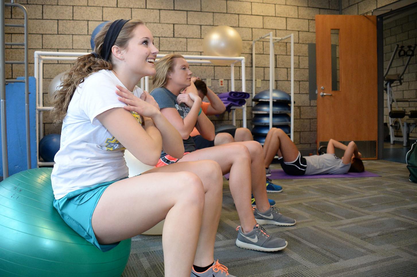 Kinesiology students user the exercise ball.